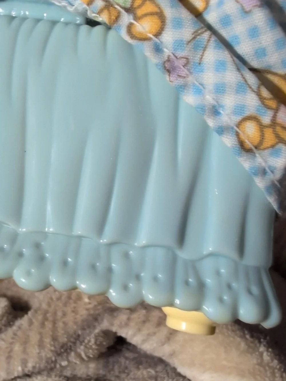 Fisher-Price doll into crib